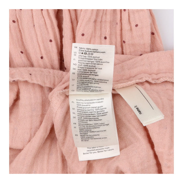 Long sleeve pink collared dress with plum spots