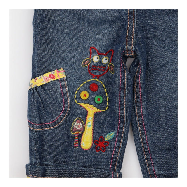 patchwork jeans with flowers and owl appliques