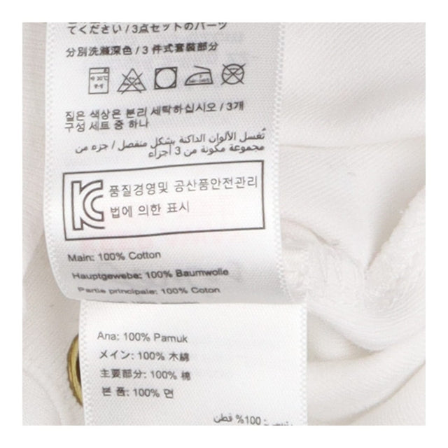 White sleepsuit with yellow duck