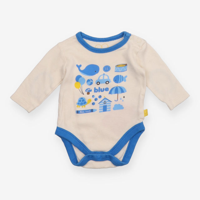White Bodysuit with Blue Objects