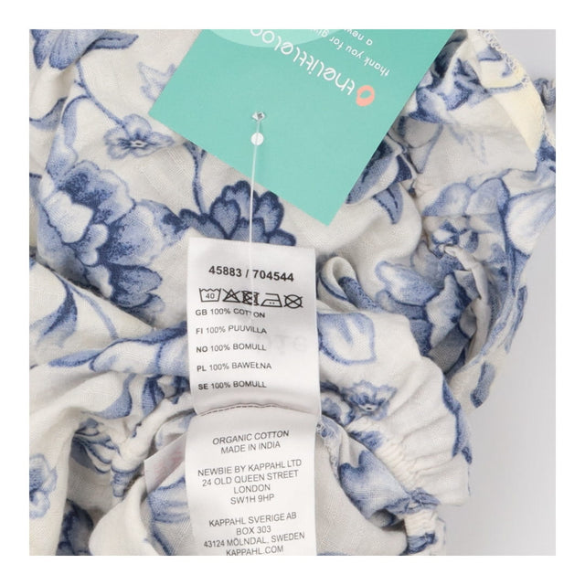 Romper white linen blue flowers