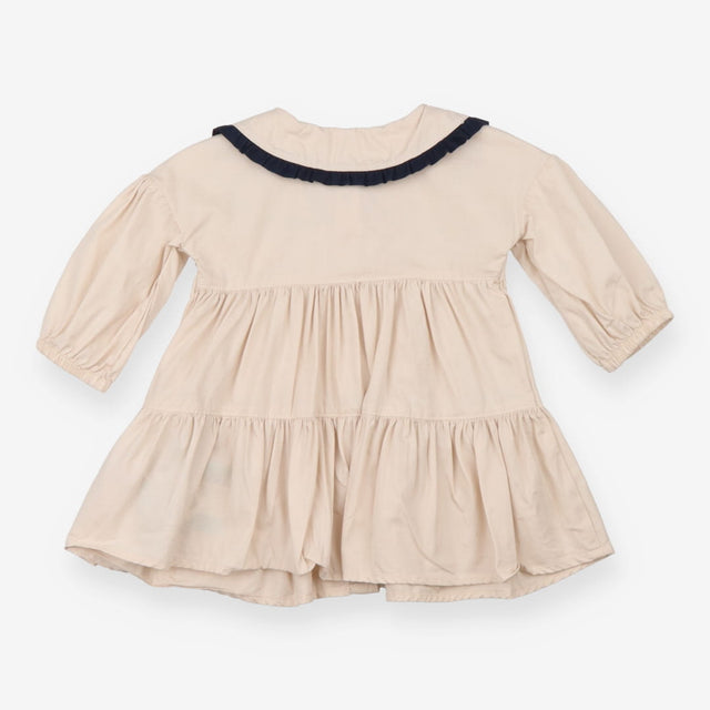 Beige collared dress with navy and heart applique