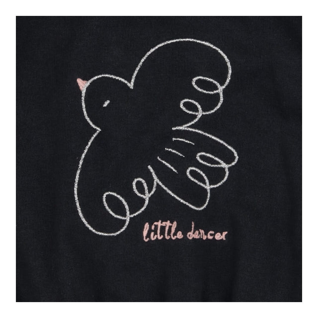 Outfit black bird sweater green leggings