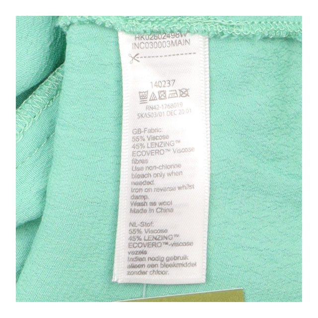 Green Sleeveless Ruffle Front Blouse