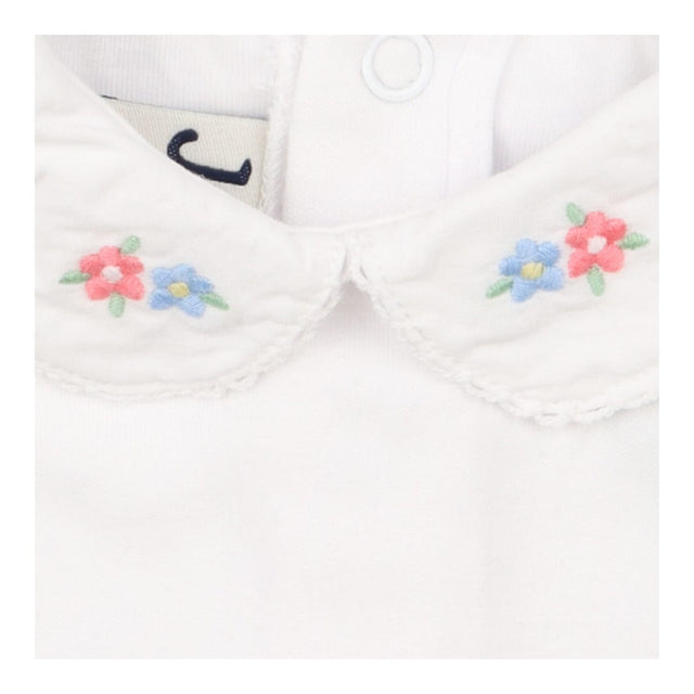 White collared bodysuit with blue and pink flowers