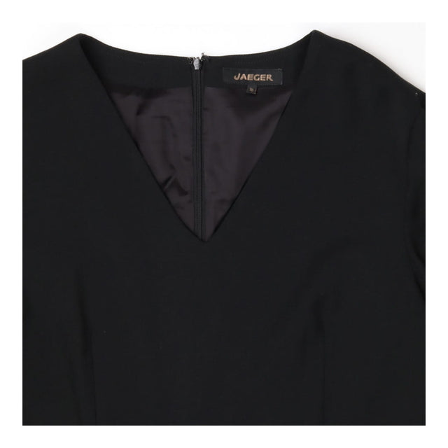 V‑Neck Black Dress – Three‑Quarter Sleeve Style