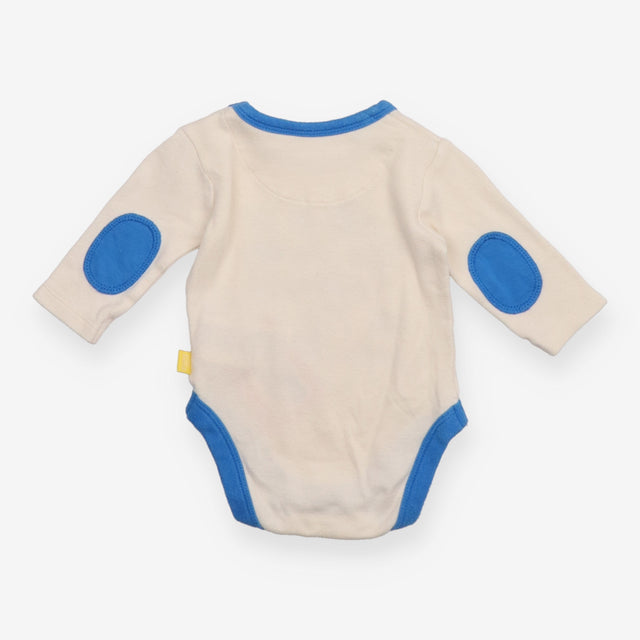 White Bodysuit with Blue Objects
