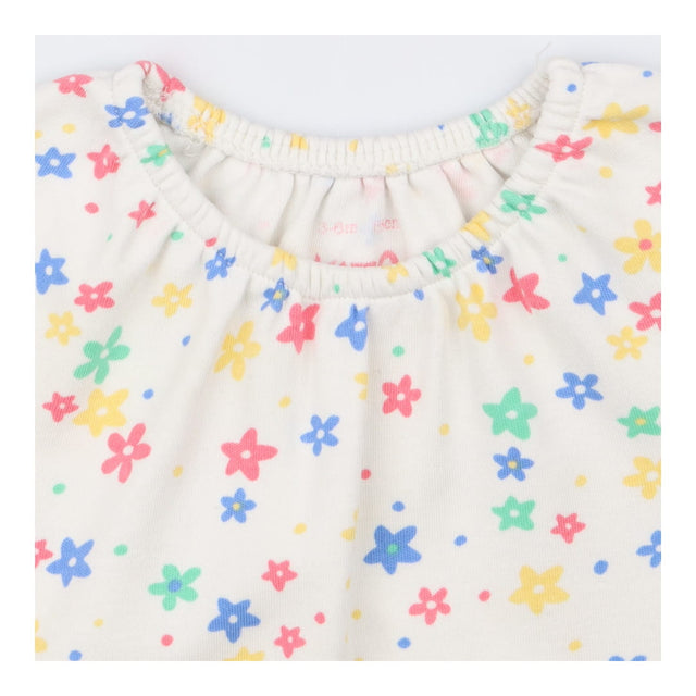 Romper Long Sleeved White Primary Flowers