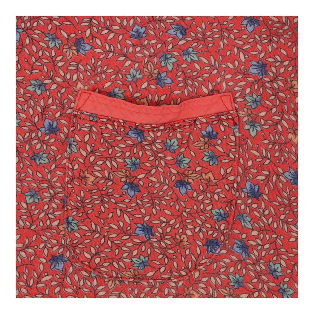 Coral red floral print long sleeve top with pocket