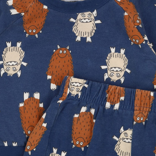 Blue tracksuit with furry monsters