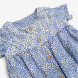Romper blue and white leaf pattern with wood effec