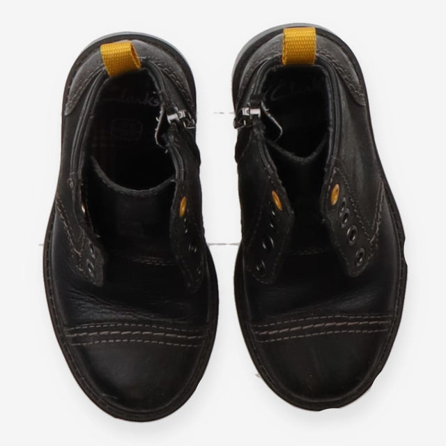 Black boots yellow eyelets
