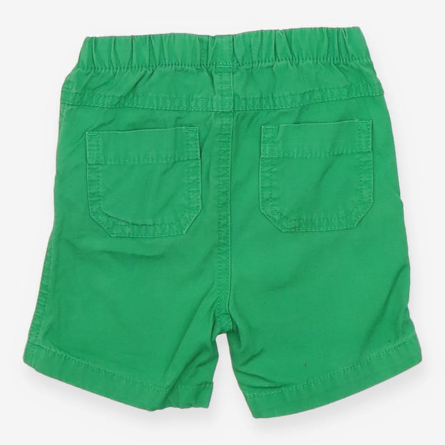 Green shorts white blue tie