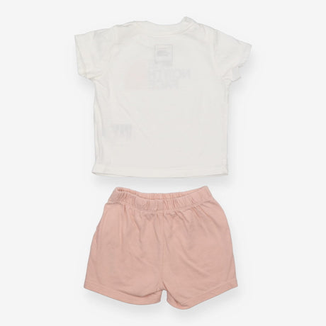 White t-shirt with pink shorts