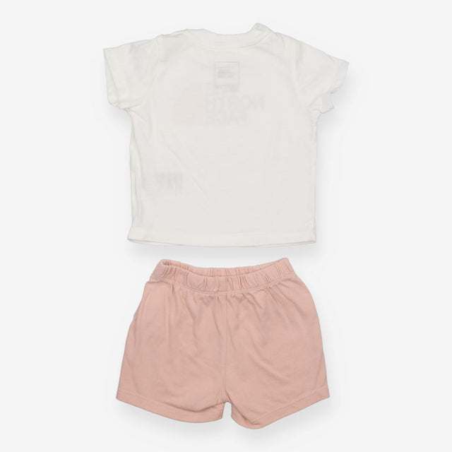 White t-shirt with pink shorts