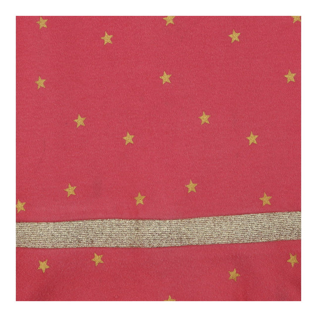 Pink long sleeve jersey dress with gold stars