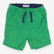 Green shorts white blue tie