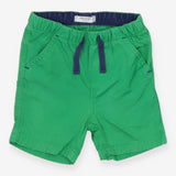 Green shorts white blue tie