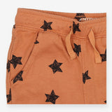 Brown drawstring jogger with black sketch stars
