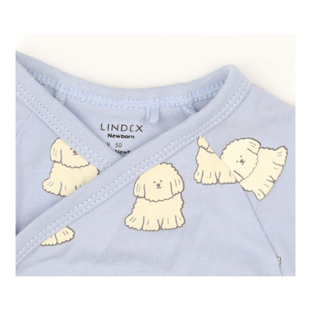 Blue bodysuit long sleeve with white fluffy dogs