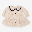 Beige collared dress with navy and heart applique