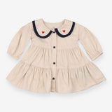 Beige collared dress with navy and heart applique