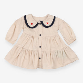 Beige collared dress with navy and heart applique