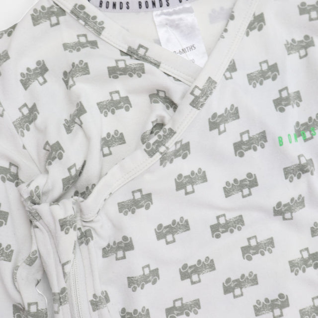 White sleepsuit grey tractors