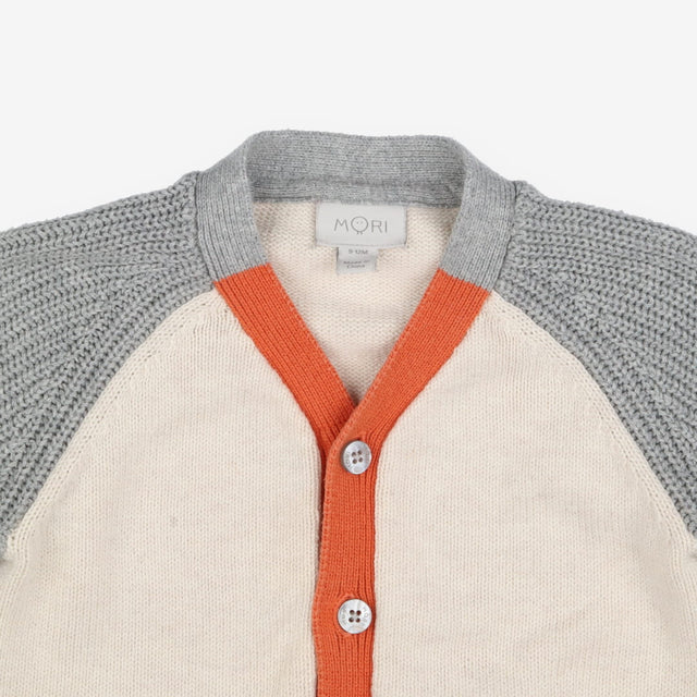 Cardigan grey sleeves cream body orange edging