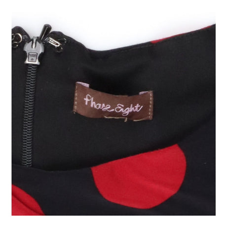 Dress black with  large red spots