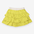 Green ruffle skort with gold stripe waistband