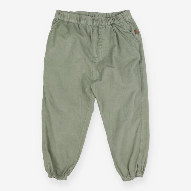 Green cord trousers