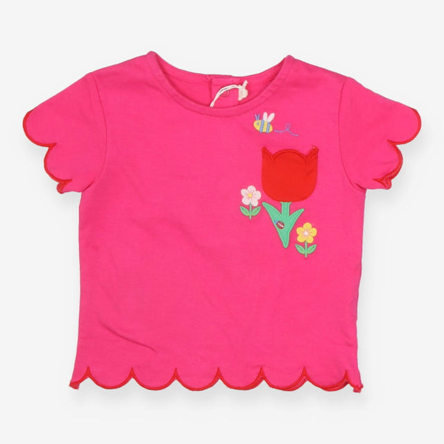 Pink t-shirt with big red tulip