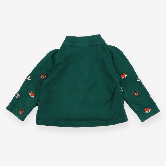 Green polo shirt with woodland animals