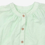Green dress with embroidered detail