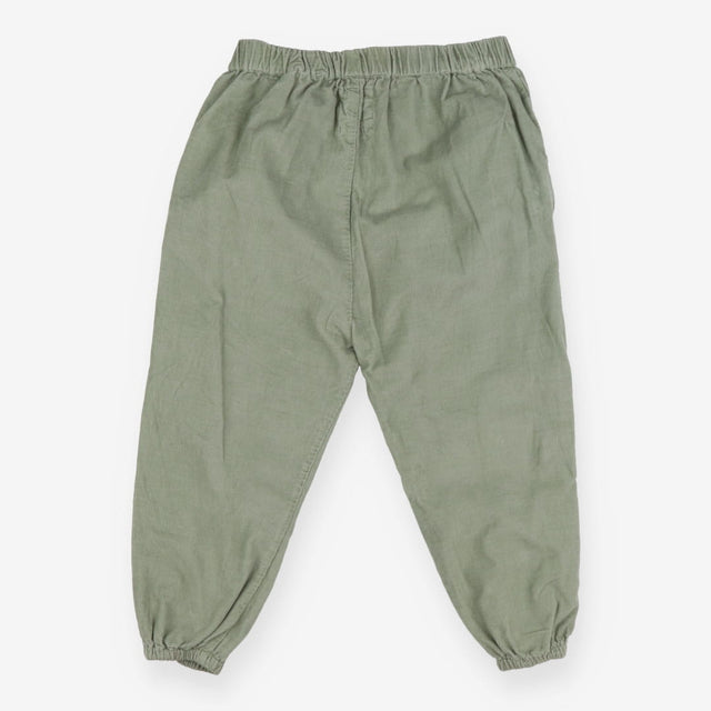 Green cord trousers