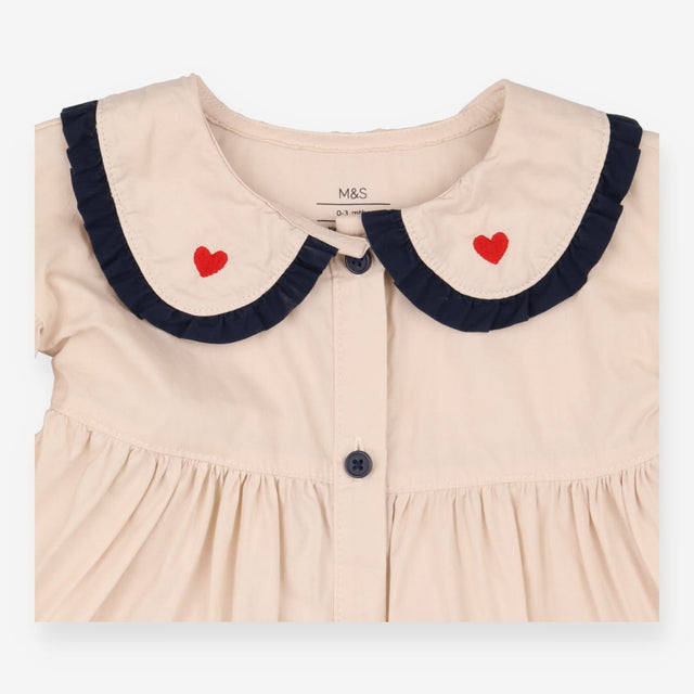 Beige collared dress with navy and heart applique