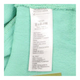 Green Sleeveless Ruffle Front Blouse