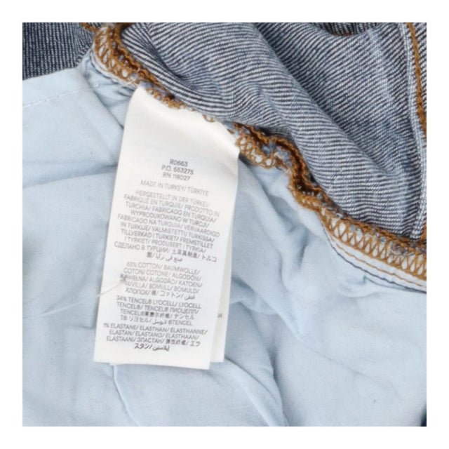 Mid Blue Girlfriend Jeans – Relaxed Fit, Mid Rise 