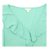 Green Sleeveless Ruffle Front Blouse