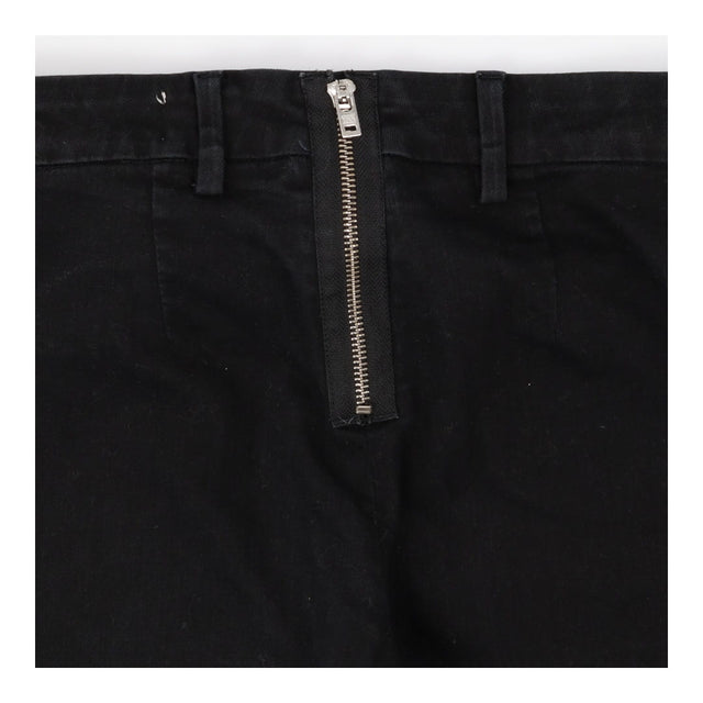 Slim leg denim trouser with rear fastening