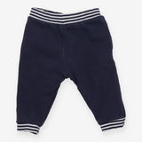 Navy joggers with red buttons