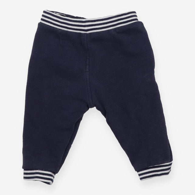 Navy joggers with red buttons