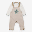 Beige dungarees with green turtle and bodysuit