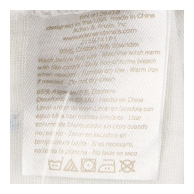 White zip muslin sleepsuit with blue stars