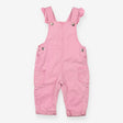 Pink denim dungarees with frill straps