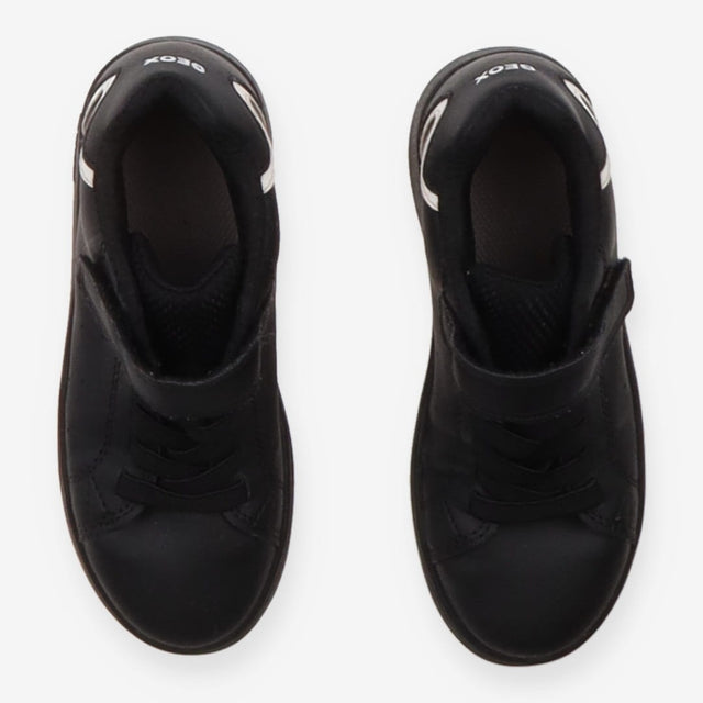 Trainers black white marks on heel velcro