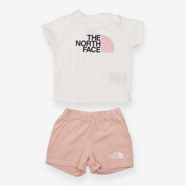 White t-shirt with pink shorts