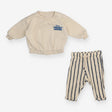 Outfit Cream Sweater and Blue Stripe Trousers