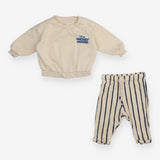 Outfit Cream Sweater and Blue Stripe Trousers